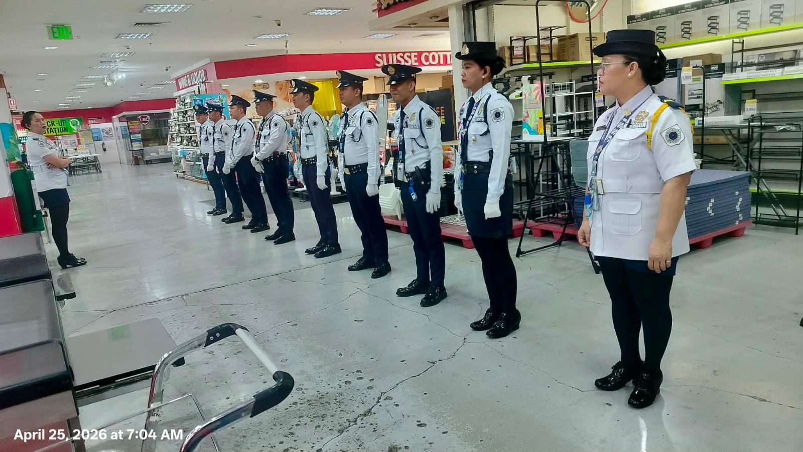 Jericko guards standing in a line inside a department store before opening